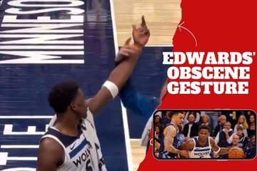 Minnesota Timberwolves' Anthony Edwards flips off the Memphis Grizzlies and an assistant coach has to calm him down