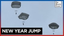 Japanese, US paratroopers leap from aircraft for annual New Year drills