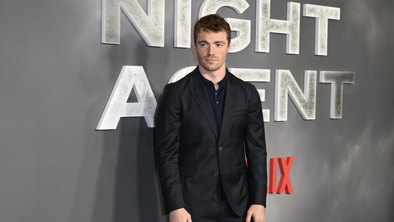 Gabriel Basso awkwardly tries to avoid hugging Kelly Ripa in front of Mark Consuelos on Live