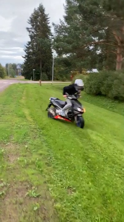 Guy Falls Riding Scooter on Grass