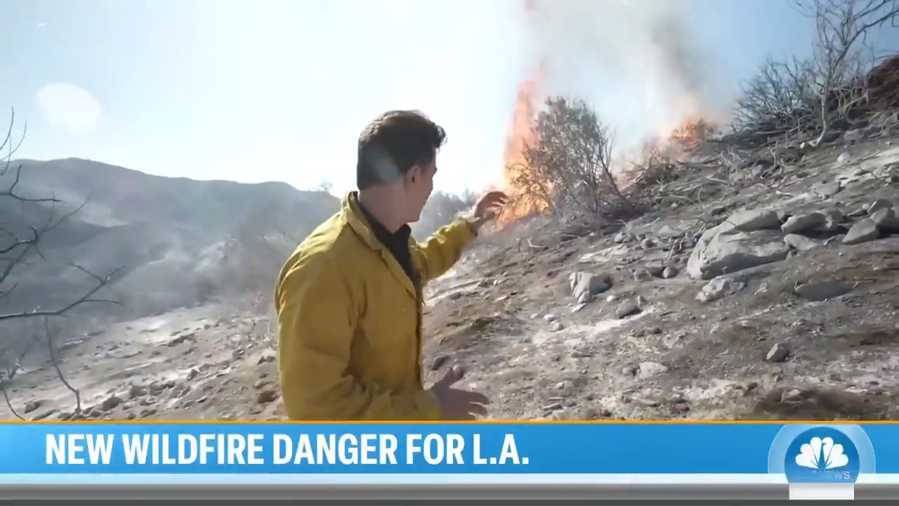 Firefighters race to contain LA wildfires before winds pick up again