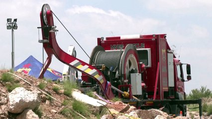 South African rescuers pull corpses and survivors from gold mine