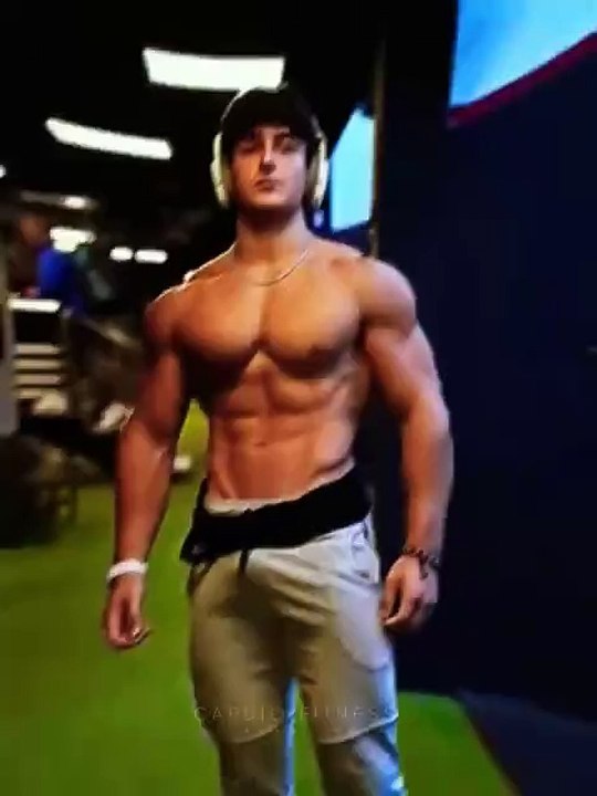 A bodybuilder boy showcases his physique.