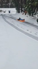 Boy Crashes Into Trash Can While Sliding Down Snow