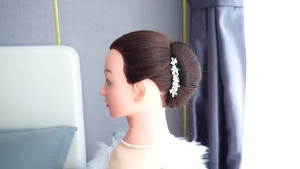 "Elegant Office Bun: Perfect Hairstyle for a Professional Look"