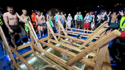 Russians plunge into freezing water to celebrate Epiphany