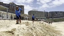 City lifeguards Sid Forbes and Bailey Connolly  cleaning up Newcastle beach after storms | Newcastle Herald | January 19, 2025