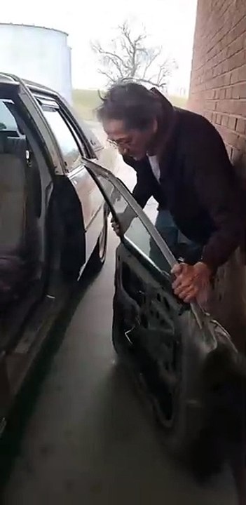 A man and car door