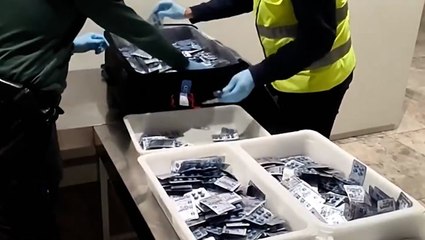 Watch moment police uncover 20,000 sexual enhancement pills in woman's airport suitcase
