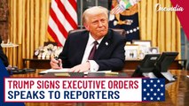 President Trump signs executive orders on his first day in office while addressing reporters