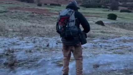 Man's hiking adventure transforms into a free slide upon stepping on ice