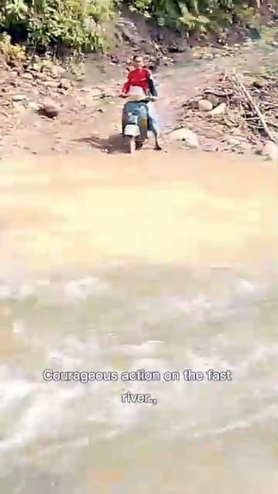Riding a Vespa on a fast river, this man is really brave!"