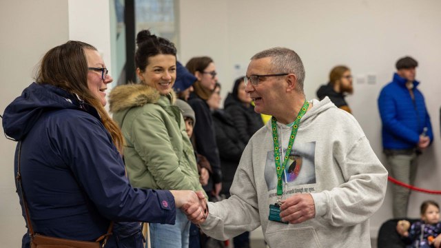 Autistic man who once struggled to hug his kids sets new world record for hugs