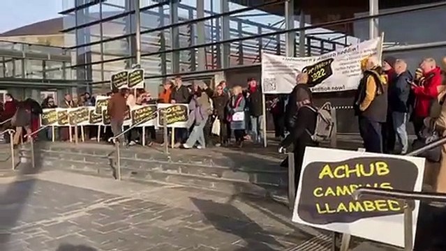 Lampeter university campaigners sing Yma o Hyd on the steps of the Senedd in Cardiff Bay