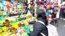 Woman Aims for Dartboard But Hits Toy Instead