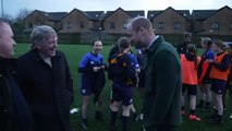 Prince William watched by Kenny Dalglish playing football