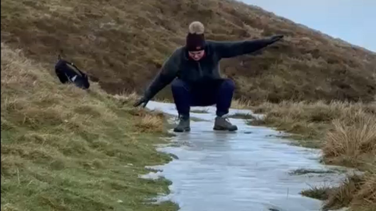 Ice wanderer begins sliding on ice during a walk