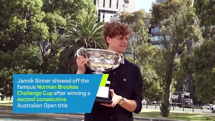 Sinner shows off Australian Open trophy after retaining his crown