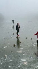 Frozen lake walk becomes a comedy as man's balance fails him repeatedly