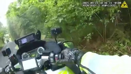 Dangerous driver reverses into police motorbike