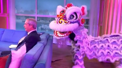 Nigel Farage has awkward encounter with Chinese Dragon live on This Morning