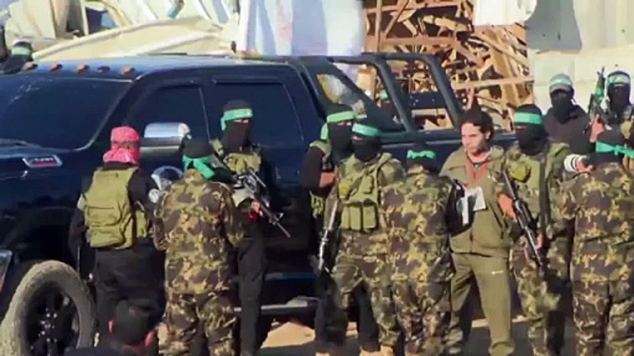 Watch: Hamas militants hand over Israeli hostages Yarden Bibas and Ofer Kalderon to Red Cross under ceasefire deal