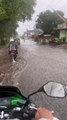 Rider's bike ride through a flooded road took an unexpected splashy turn