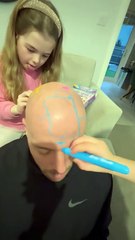 Family fun: Adorable kids use hair chalks to decorate dad’s head