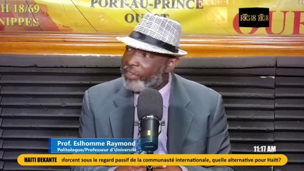 Eslhomme Raymond frape Leslie Voltaire fò sou dosye nèg ak zam yo.