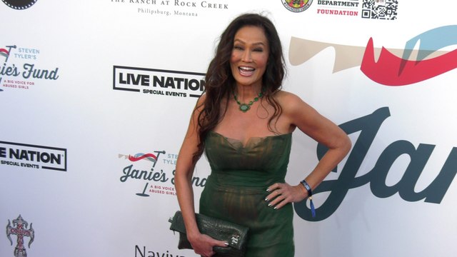 Tia Carrere on the red carpet at Steven Tyler’s 6th annual Grammy Awards viewing party