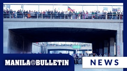 Marchers protesting planned deportations block major freeway in Los Angeles