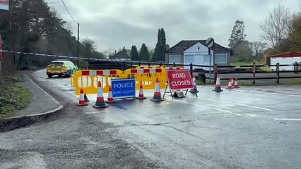Police shut road to investigate 'unusual appearance of soil' in woods