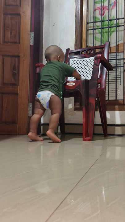 Kid trying to sit chair