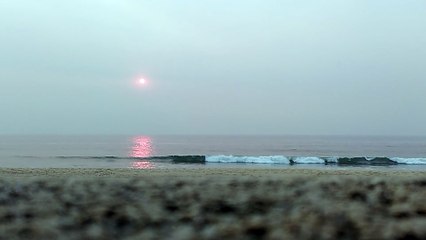 Red sun over the Atlantic ocean in Portugal