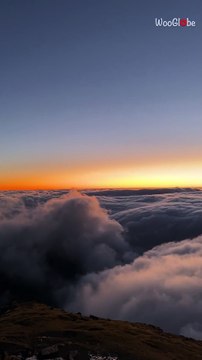 Surreal Snowdon sunrise shows clouds flowing like water in an unforgettable morning scene