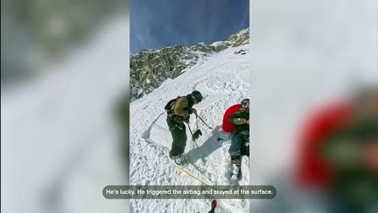 Skier is swept away by tumbling avalanche but survives thanks to airbag