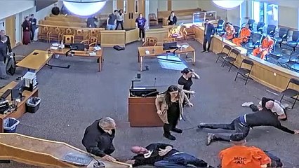 Moment courtroom brawl breaks out after uncle of murder victim attacks alleged killer