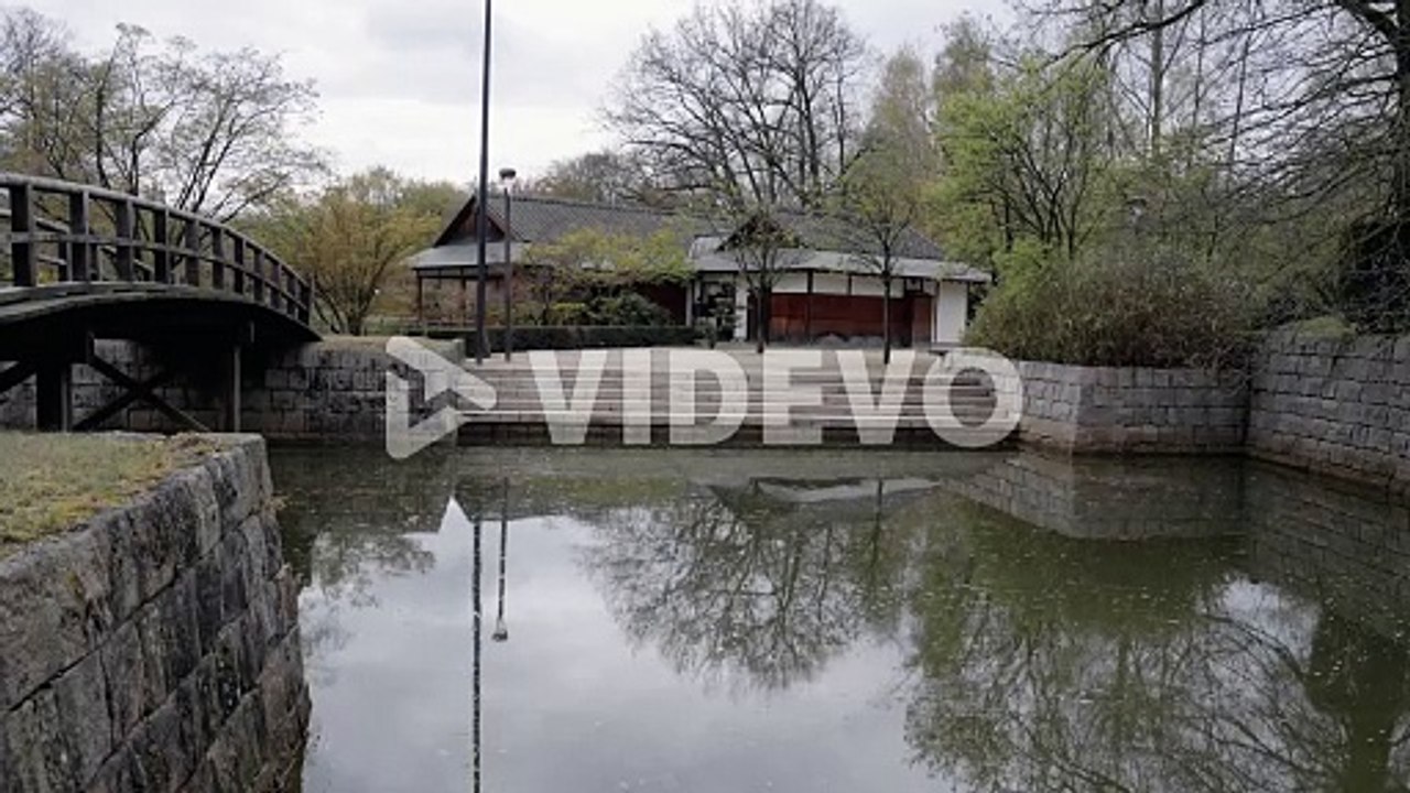 Ceremony tea house by the pond and bridge in the Japanese garden1