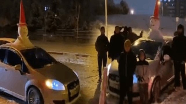 Otomobilinin tavanına yaptığı 'kardan adam' ile şehir turu attı