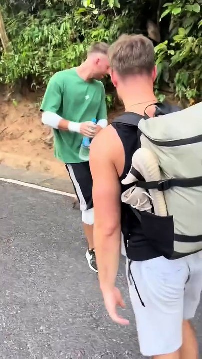 Monkey Snatches Water Bottle From Man While Walking on Road