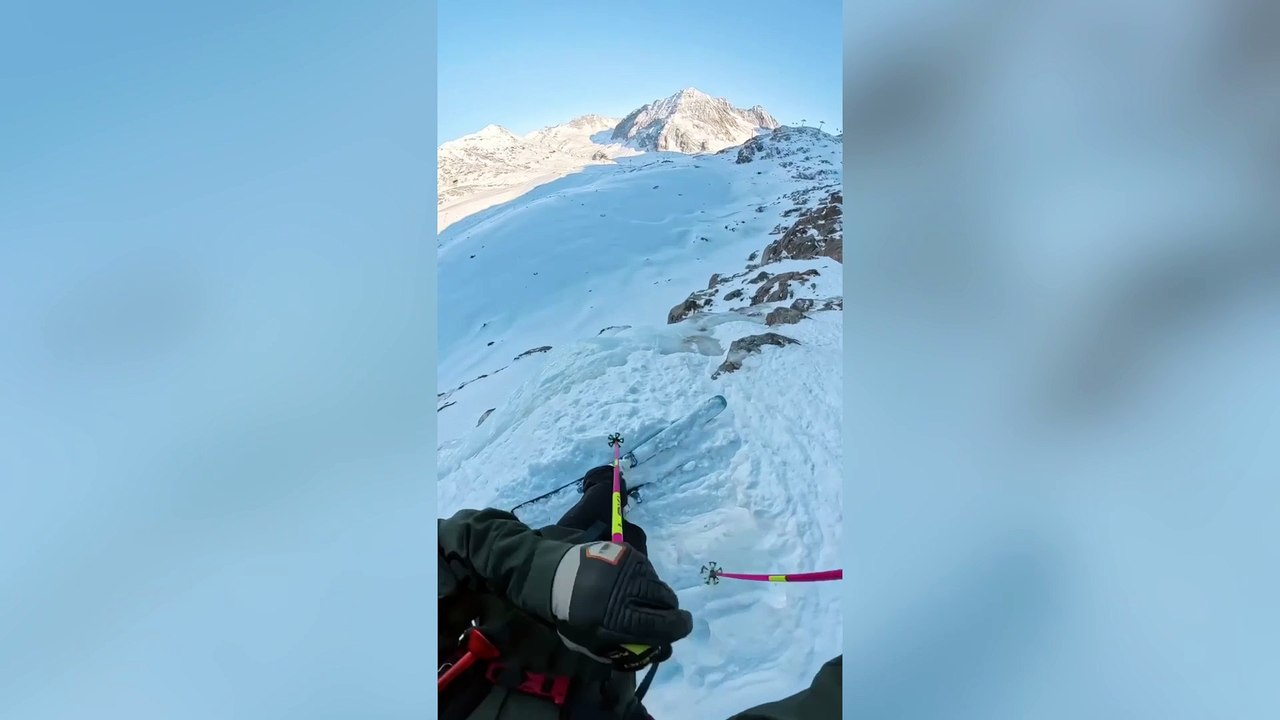 Moment professional skier tears ACL falling down cliff in jump gone wrong