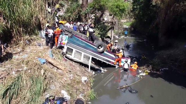 At least 50 dead after bus plunges off bridge in Guatemala