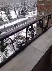 Damascus streets and cars covered in snow