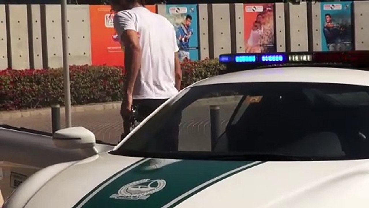Spanish tennis player Feliciano Lopez takes a spin in Dubai Police Car