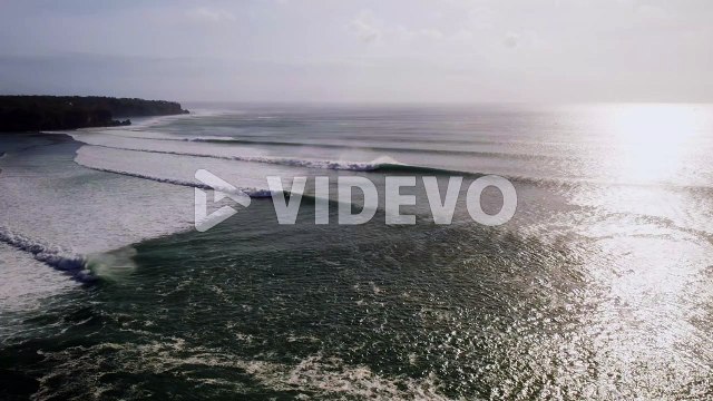 Uluwatu bali island surf famous spot destination aerial view at sunrise with huge ocean waves