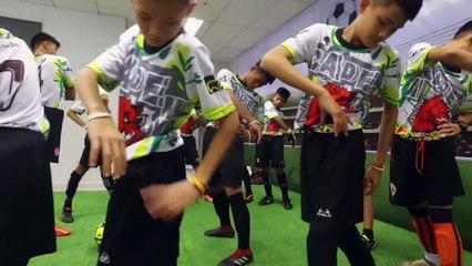 Thai cave boys play football with their rescuers