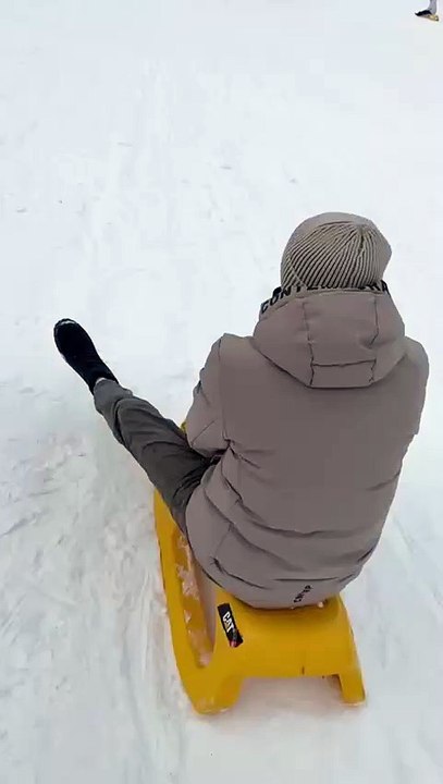Sledding session takes a funny turn when two sleds crash into each other