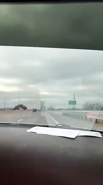 Truck�s Mesh Tarp Snags on Billboard and Driver Unknowingly Moves Forward