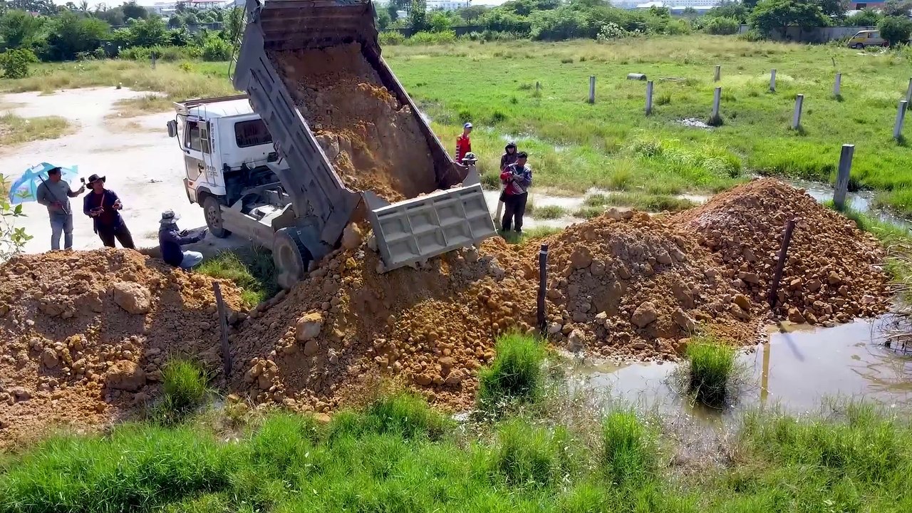 Completed Project Land size 20m X20m support by Dozer D20A & Truck 5T pushing soil on flooded land_083