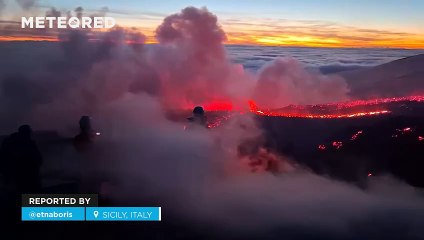 Lava and snow show at the Etna volcano eruption